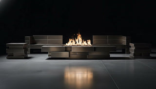 Modern outdoor fire pit with seating area on a dark background