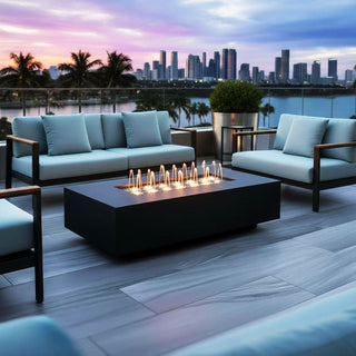 Outdoor patio setting with water fountain table and city skyline view